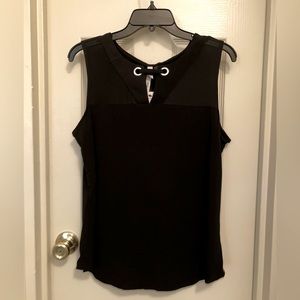BLACK SLEEVELESS BLOUSE WITH TOP FRONT SHEER PANEL AND GROMMET STYLE DESIGN